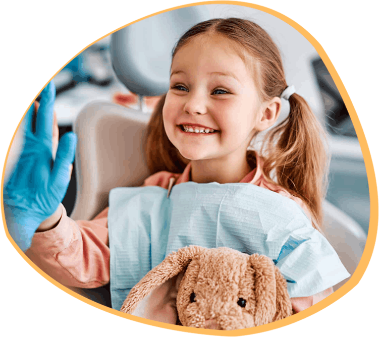 Young girl happily brushing her teeth - Friendly pediatric dental care at Bunny Kids Dental in Santa Ana