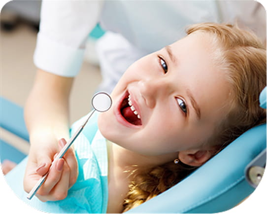 Young child smiling during a preventive dental exam and teeth cleaning at Bunny Kids Dental Santa Ana