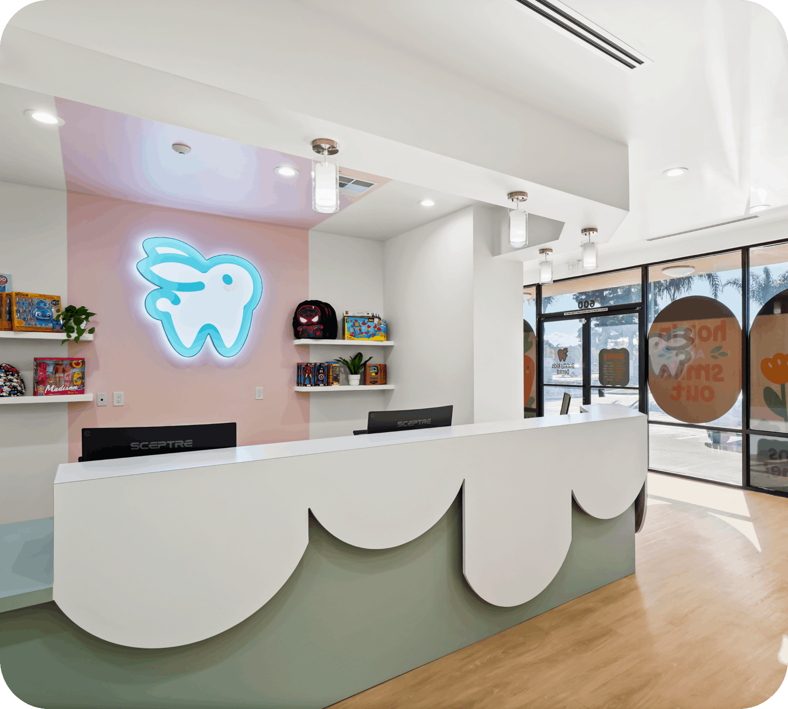 Modern front desk and reception area at Bunny Kids Dental Santa Ana